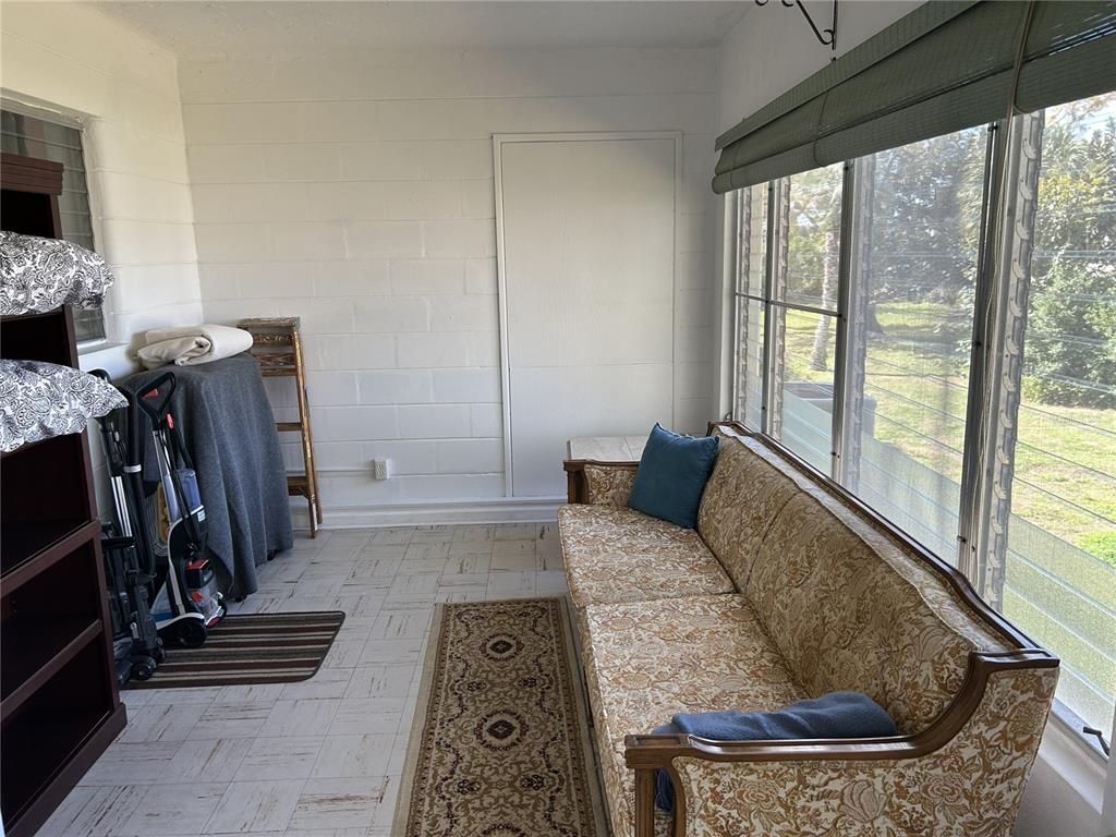 4154 57th Street North, Unit 274 Kenneth City, FL 33709 - Photo 19 of 28 a living room with furniture and a window
