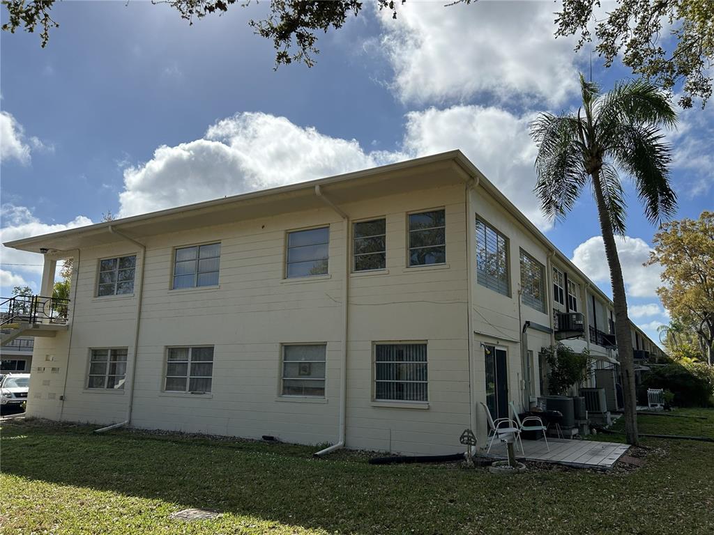 4154 57th Street North, Unit 274 Kenneth City, FL 33709 - Photo 24 of 28 a view of house with yard