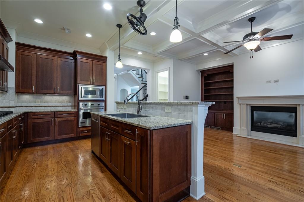 12 Candler Grove Drive Decatur, GA 30030 - Photo 13 of 33 a kitchen with stainless steel appliances granite countertop a stove a sink and a refrigerator