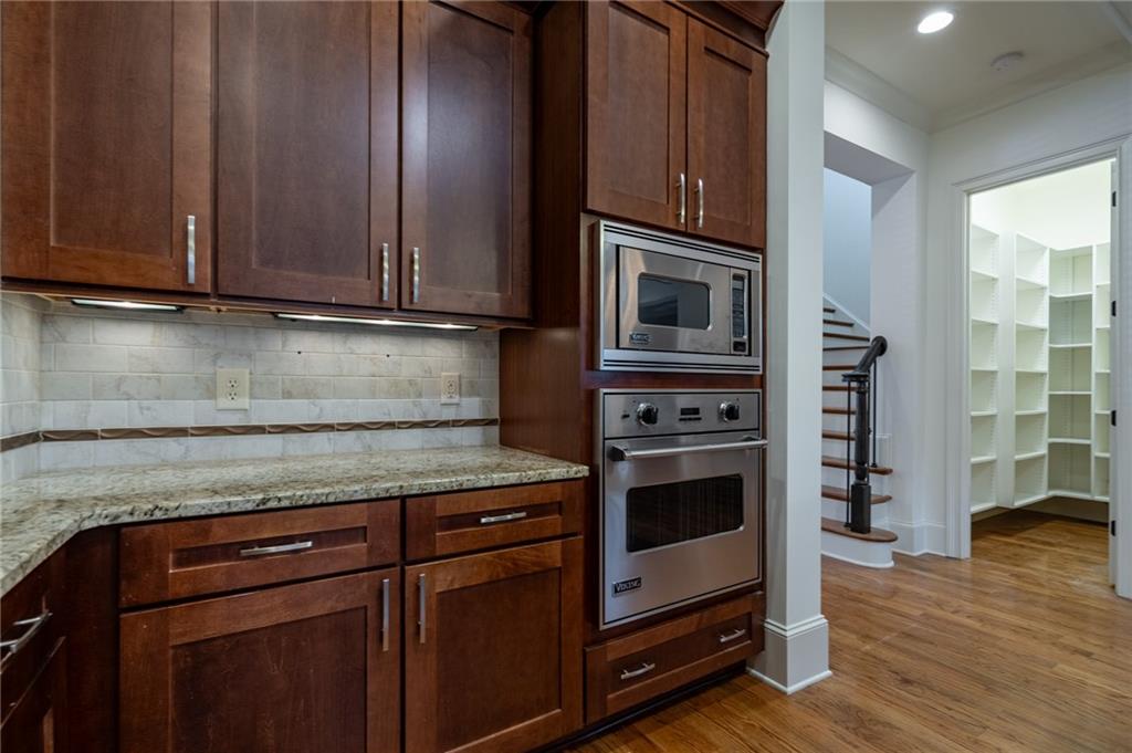 12 Candler Grove Drive Decatur, GA 30030 - Photo 15 of 33 a kitchen with granite countertop a stove microwave and cabinets