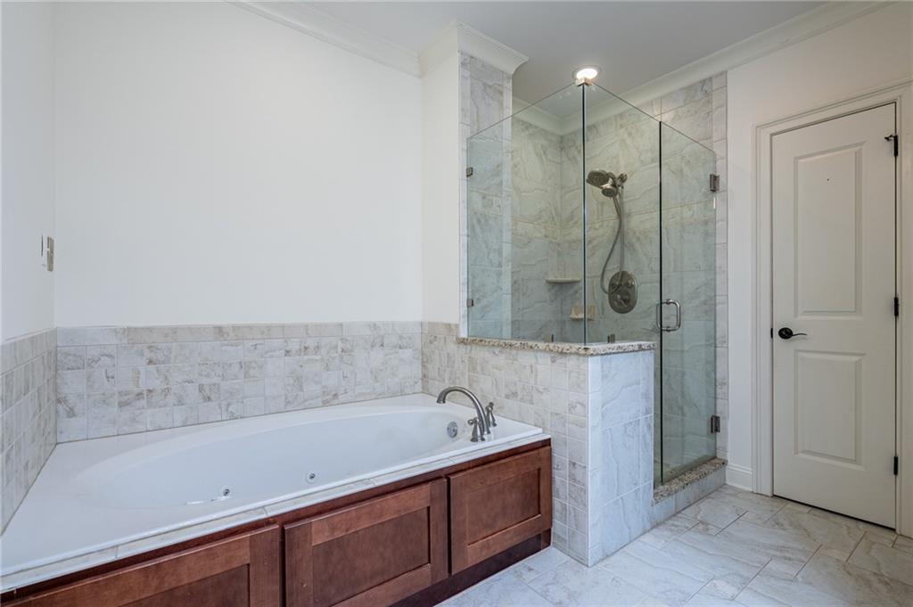 12 Candler Grove Drive Decatur, GA 30030 - Photo 26 of 33 a bathroom with a bathtub and a shower