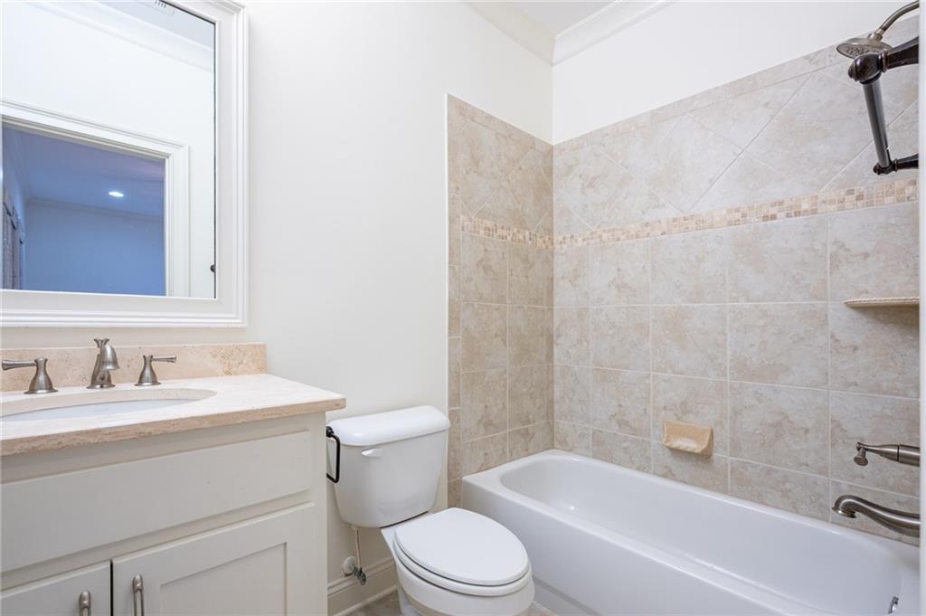 12 Candler Grove Drive Decatur, GA 30030 - Photo 32 of 33 a bathroom with a toilet a sink and a bathtub