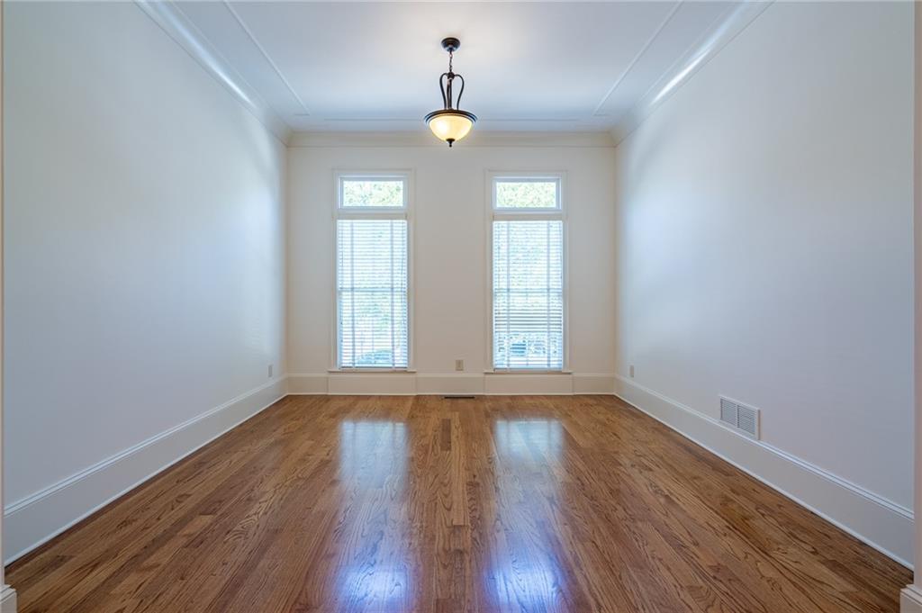 12 Candler Grove Drive Decatur, GA 30030 - Photo 6 of 33 a view of an empty room with wooden floor and a window
