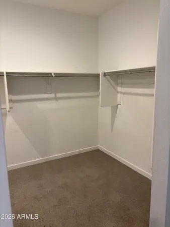 a view of an empty walk in closet