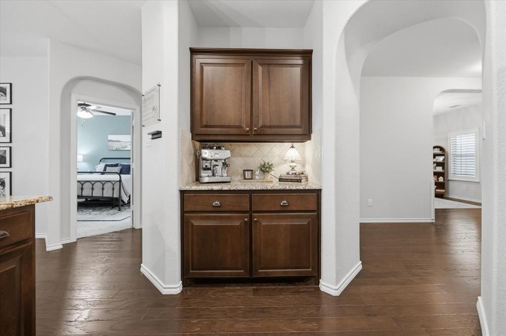448 Spring Drive Saginaw, TX 76131 - Photo 11 of 40 a view of a kitchen and an empty room