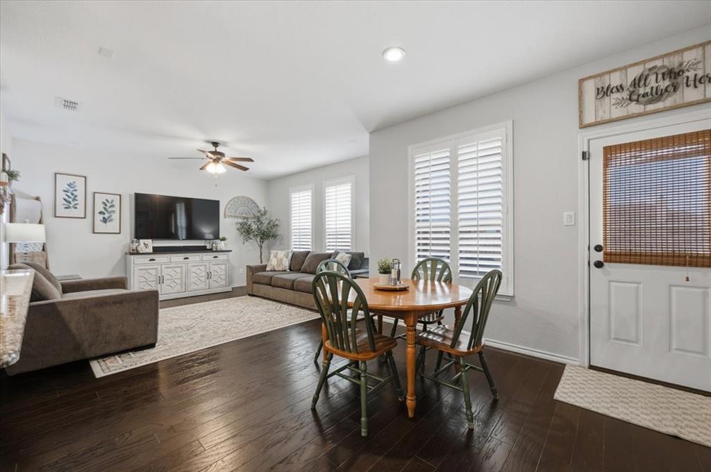 448 Spring Drive Saginaw, TX 76131 - Photo 16 of 40 a view of a dining room with furniture window and wooden floor