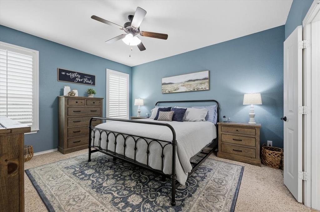 448 Spring Drive Saginaw, TX 76131 - Photo 23 of 40 a bedroom with a bed and a dresser