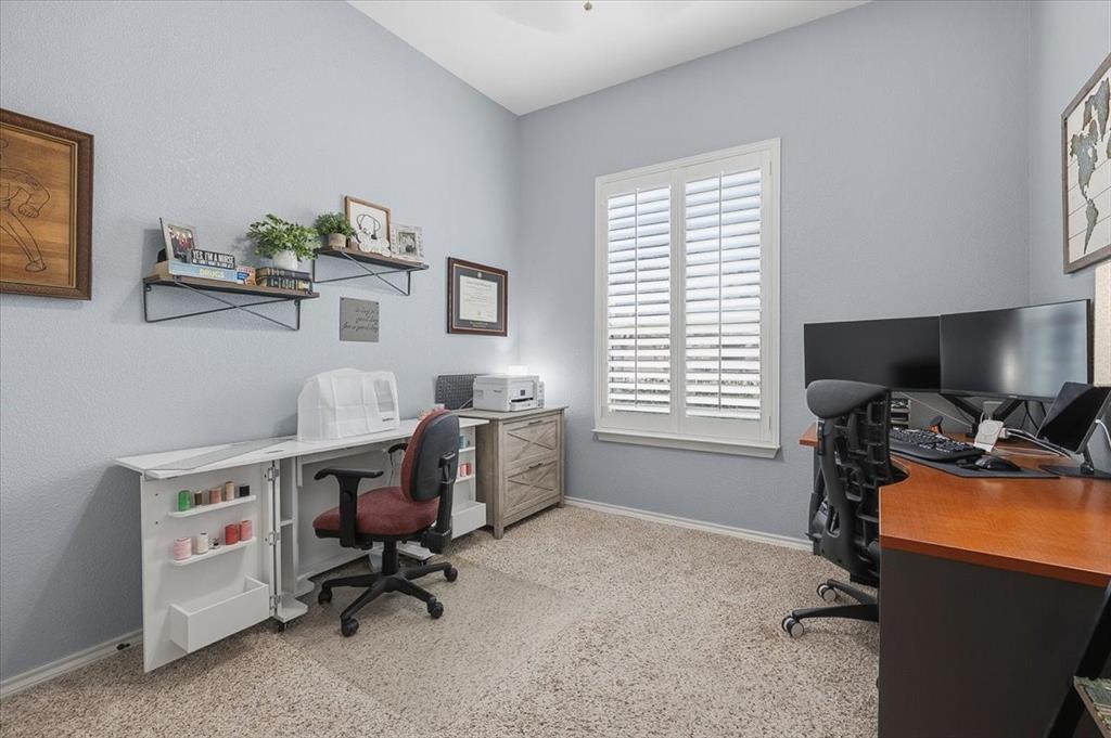 448 Spring Drive Saginaw, TX 76131 - Photo 33 of 40 a view of a workspace with furniture and a window