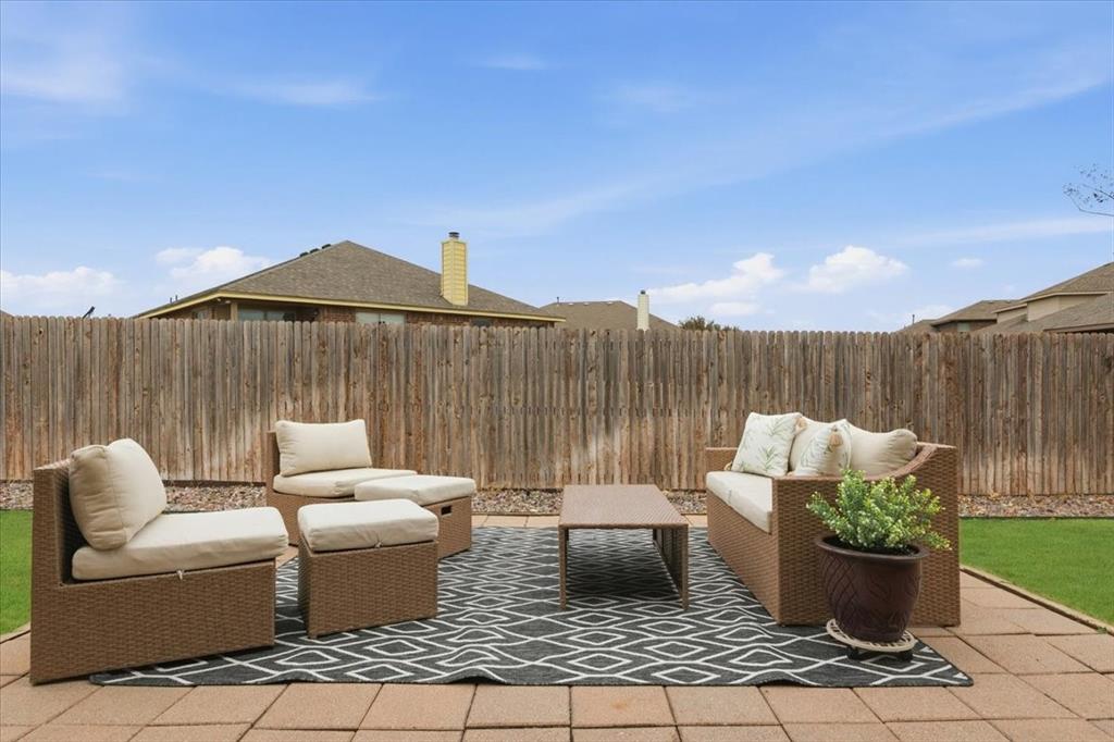 448 Spring Drive Saginaw, TX 76131 - Photo 35 of 40 a patio with couches and a potted plant