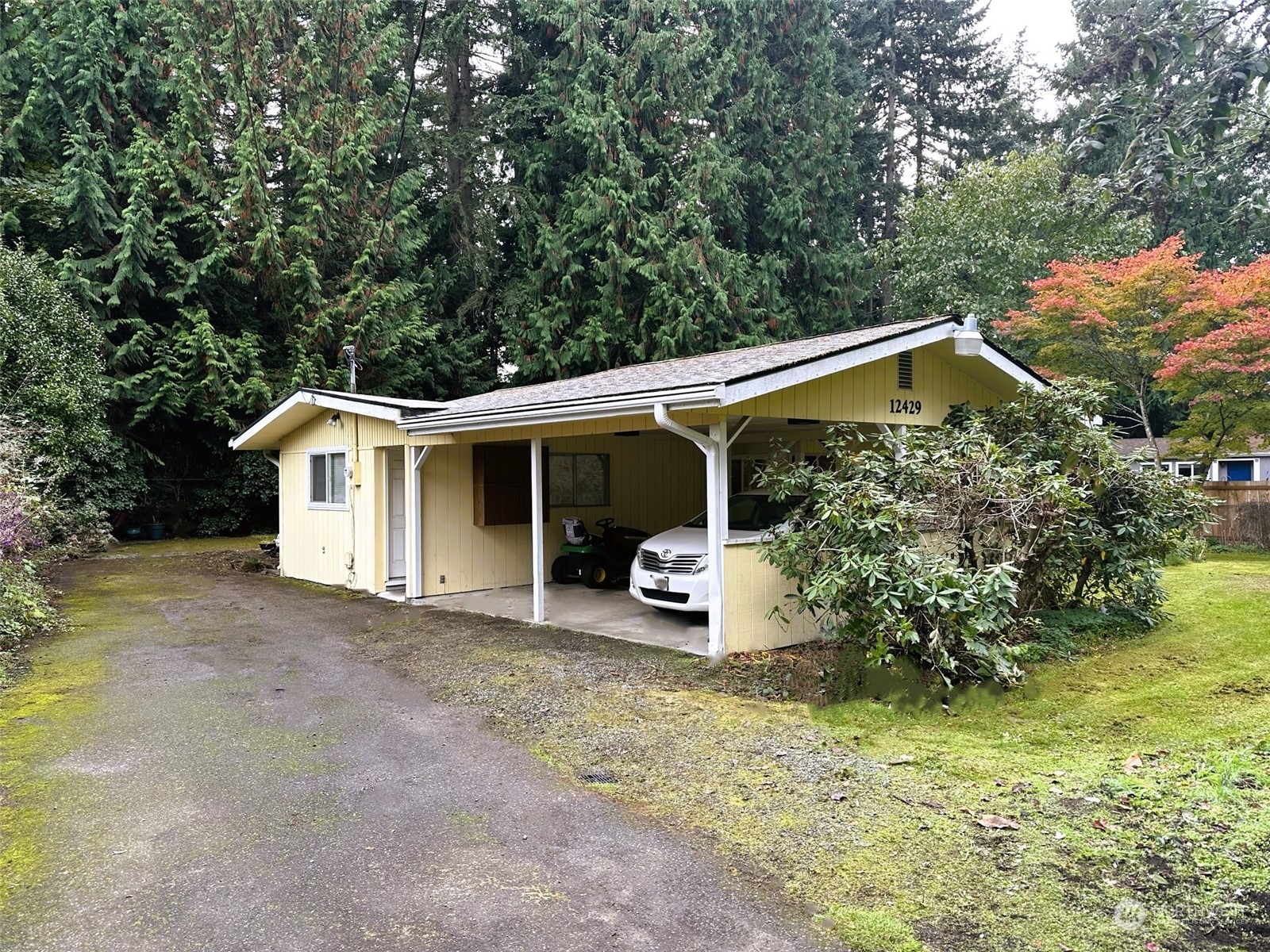 12429 Southeast 95th Way Renton, WA 98056 - Photo 1 of 15 a front view of a house with garden