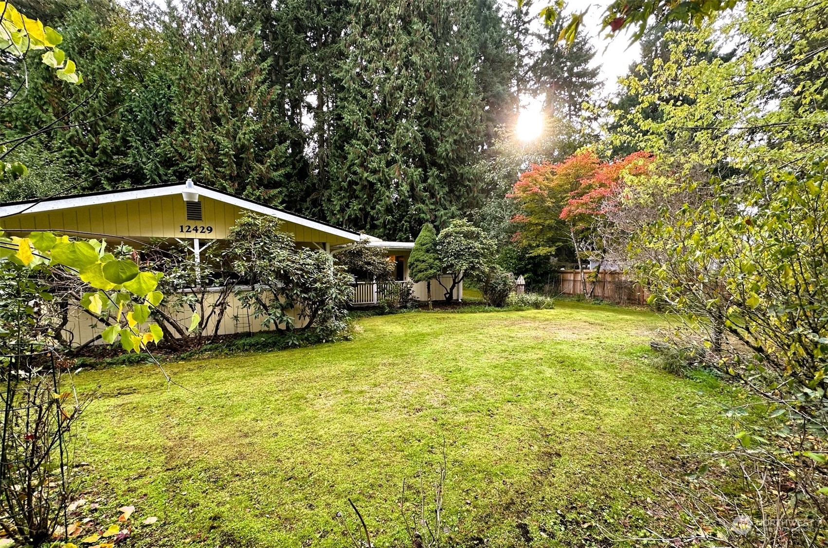12429 Southeast 95th Way Renton, WA 98056 - Photo 12 of 15 a view of a swimming pool with an outdoor seating and a yard