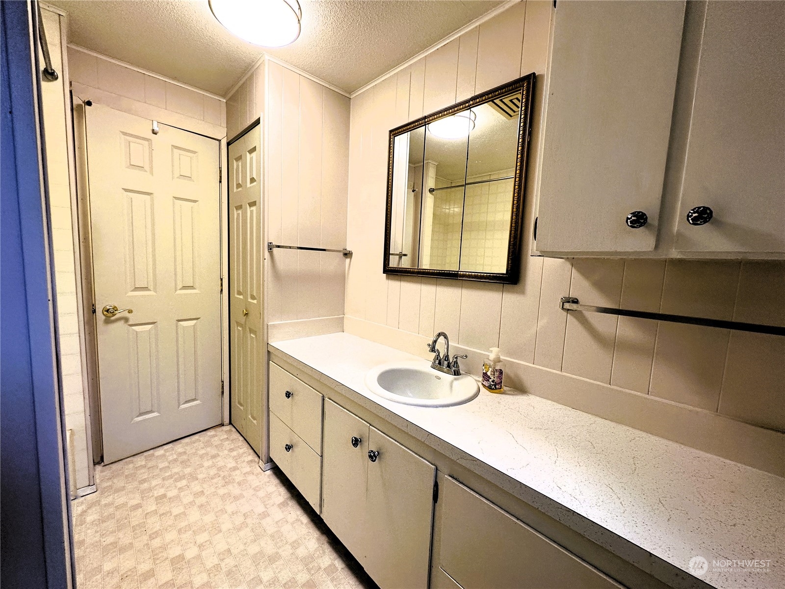12429 Southeast 95th Way Renton, WA 98056 - Photo 5 of 15 a bathroom with a sink and a mirror