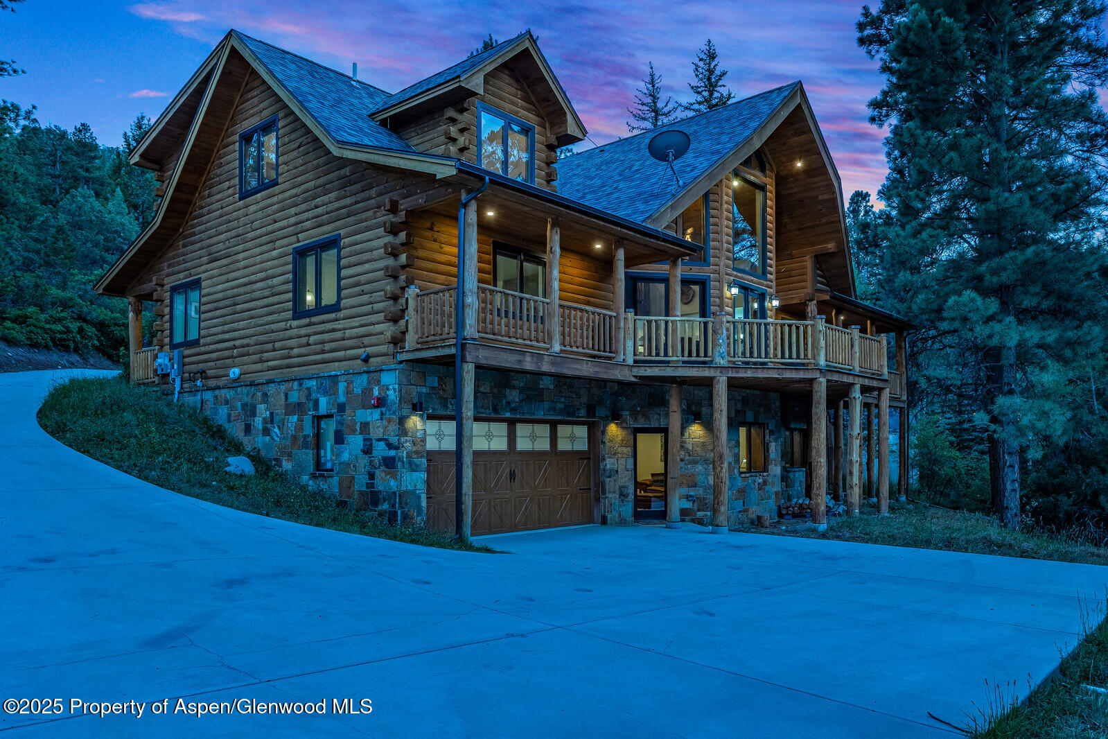 175 Bison Lane Redstone, CO 81623 - Photo 2 of 60 a front view of a house with wooden deck and a yard