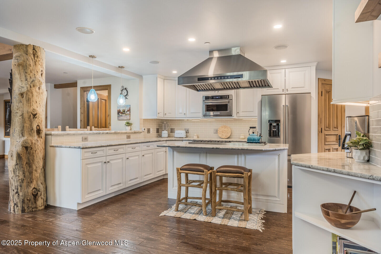 175 Bison Lane Redstone, CO 81623 - Photo 28 of 60 a kitchen with kitchen island granite countertop a sink and refrigerator