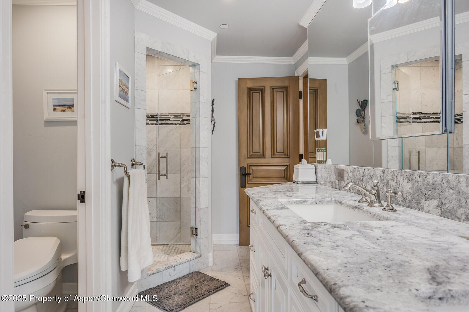 175 Bison Lane Redstone, CO 81623 - Photo 40 of 60 a bathroom with a granite countertop sink toilet and shower