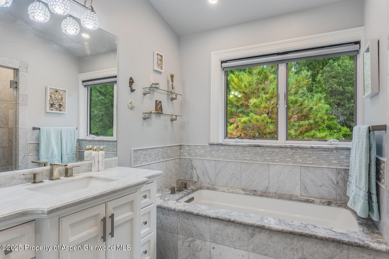 175 Bison Lane Redstone, CO 81623 - Photo 45 of 60 a bathroom with a granite countertop sink and a window
