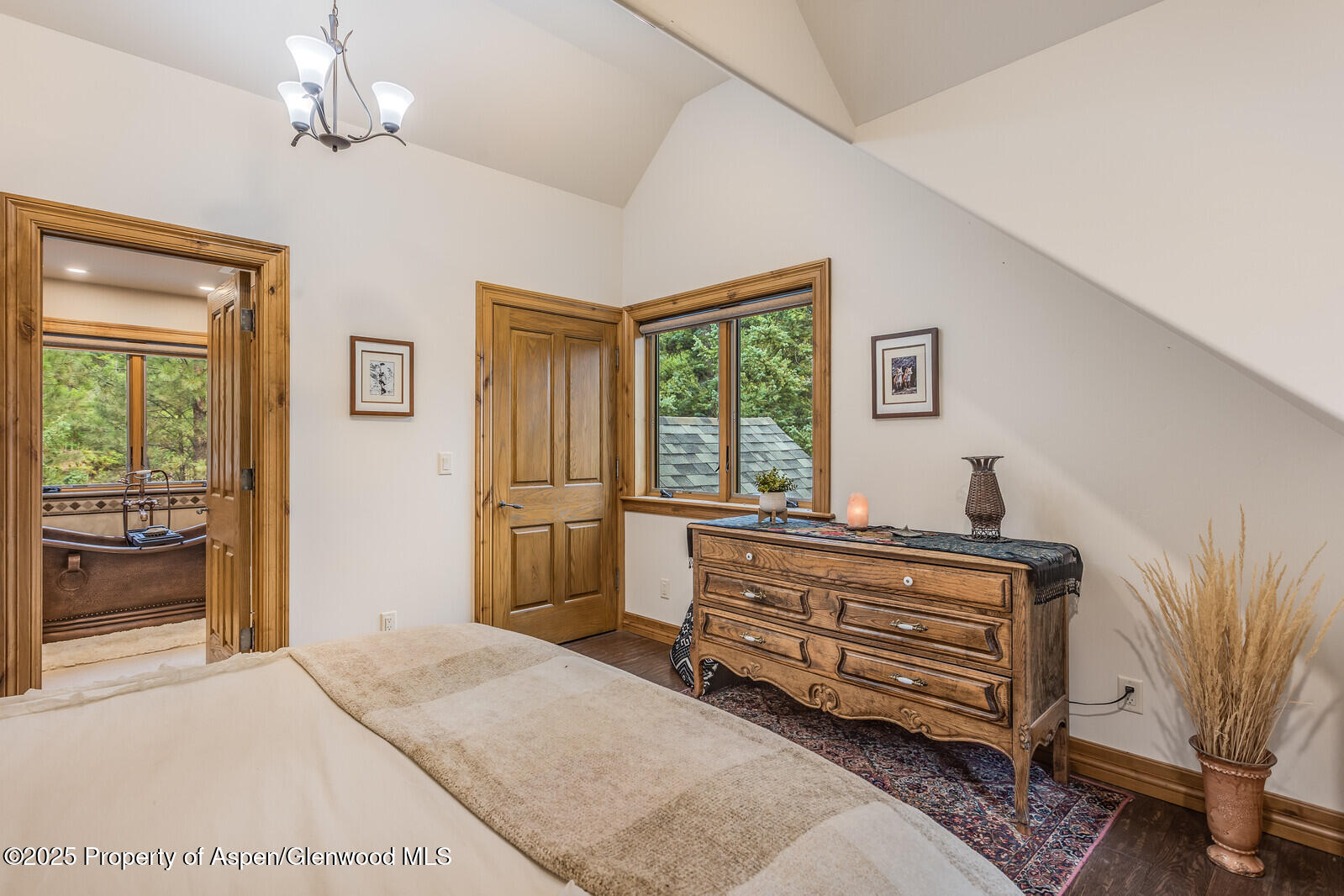 175 Bison Lane Redstone, CO 81623 - Photo 48 of 60 a living room with furniture a bed and a chandelier