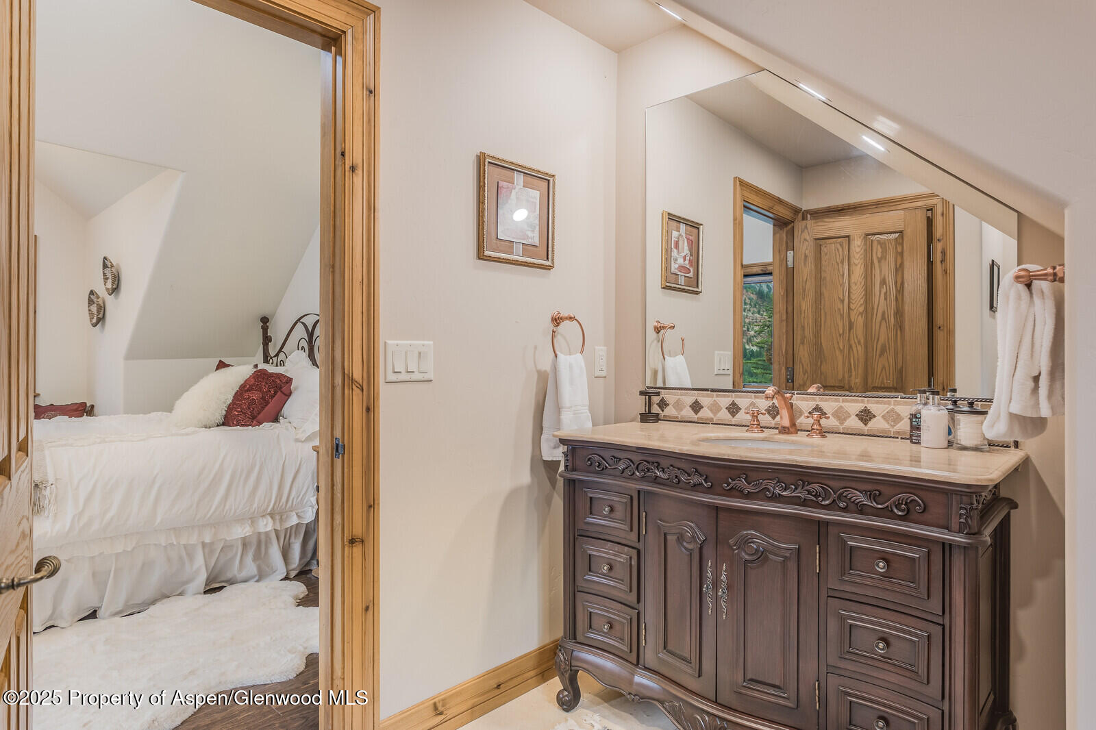 175 Bison Lane Redstone, CO 81623 - Photo 50 of 60 a en suite bathroom with a granite countertop sink and a mirror