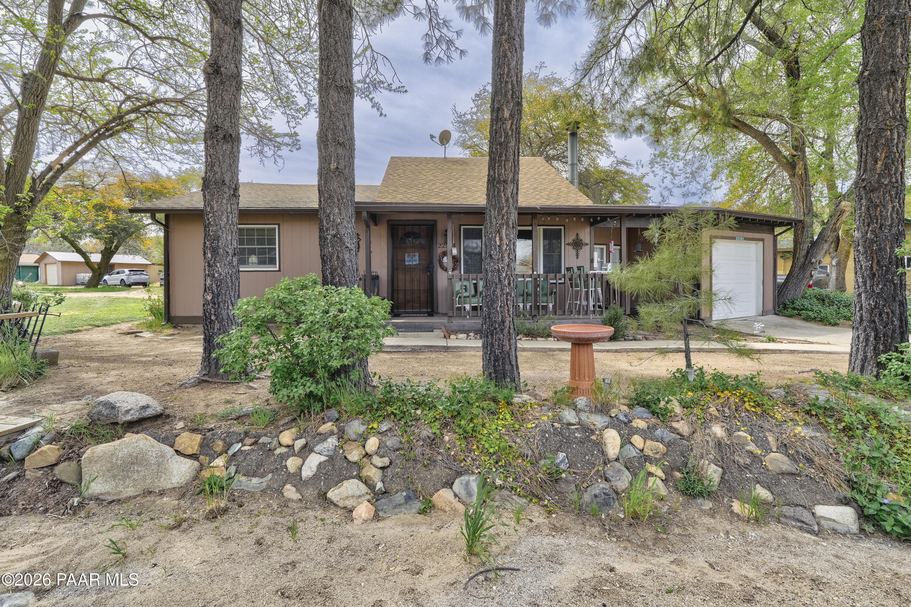 22584 Stone Way Yarnell, AZ 85362 - Photo 1 of 36 a front view of a house with garden