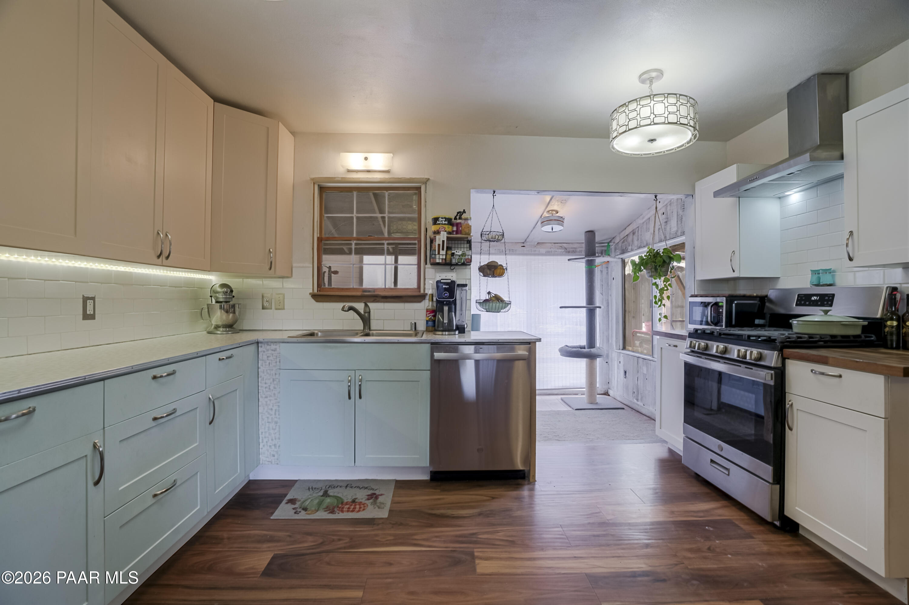 22584 Stone Way Yarnell, AZ 85362 - Photo 11 of 36 a kitchen with kitchen island granite countertop a sink cabinets and stainless steel appliances