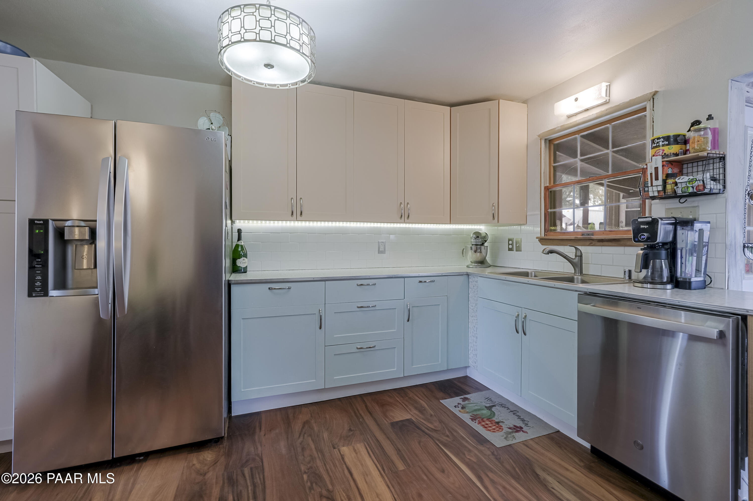 22584 Stone Way Yarnell, AZ 85362 - Photo 13 of 36 a kitchen with stainless steel appliances granite countertop a refrigerator a sink and white cabinets