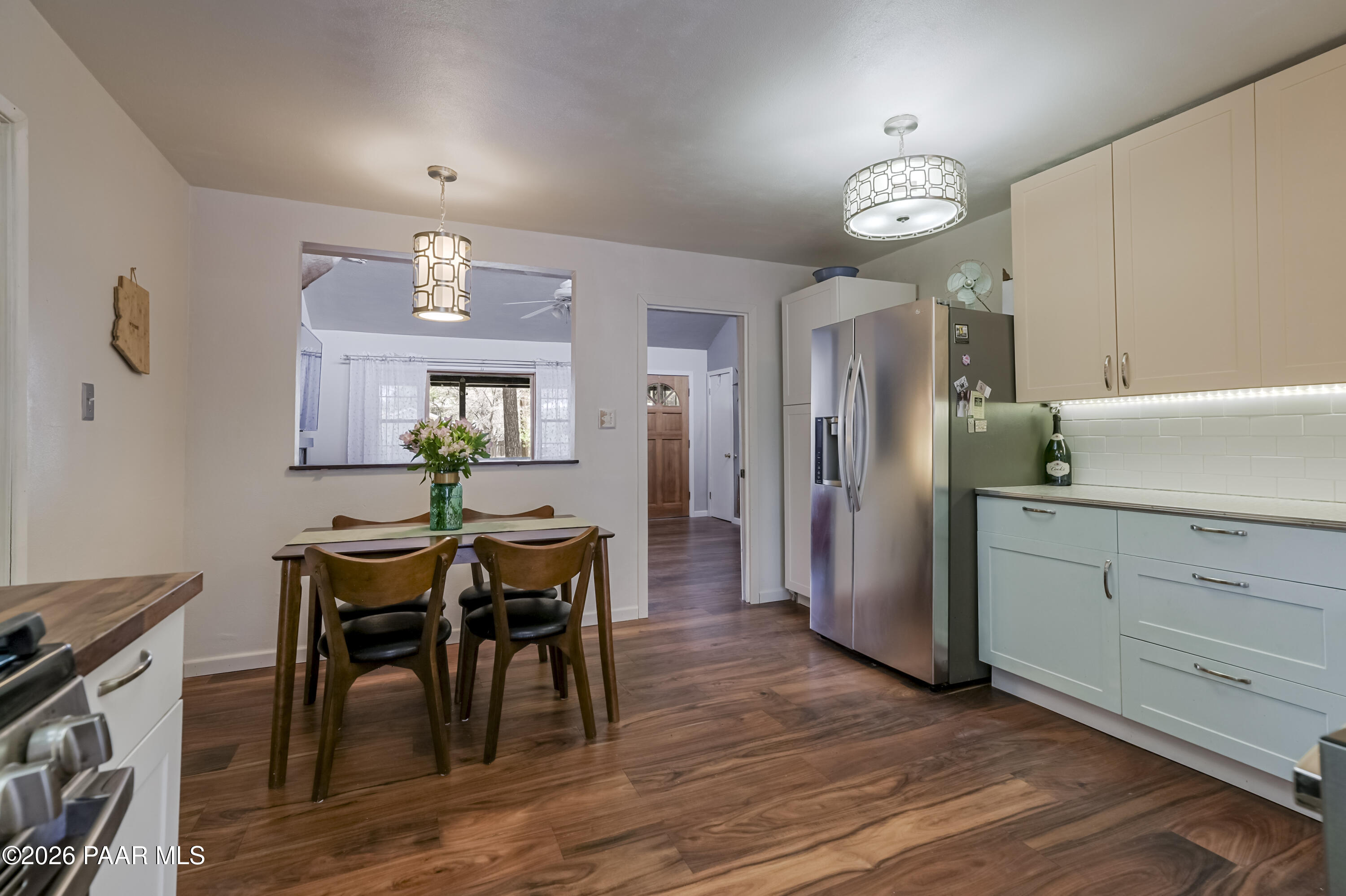 22584 Stone Way Yarnell, AZ 85362 - Photo 14 of 36 a view of a dining room with furniture and wooden floor