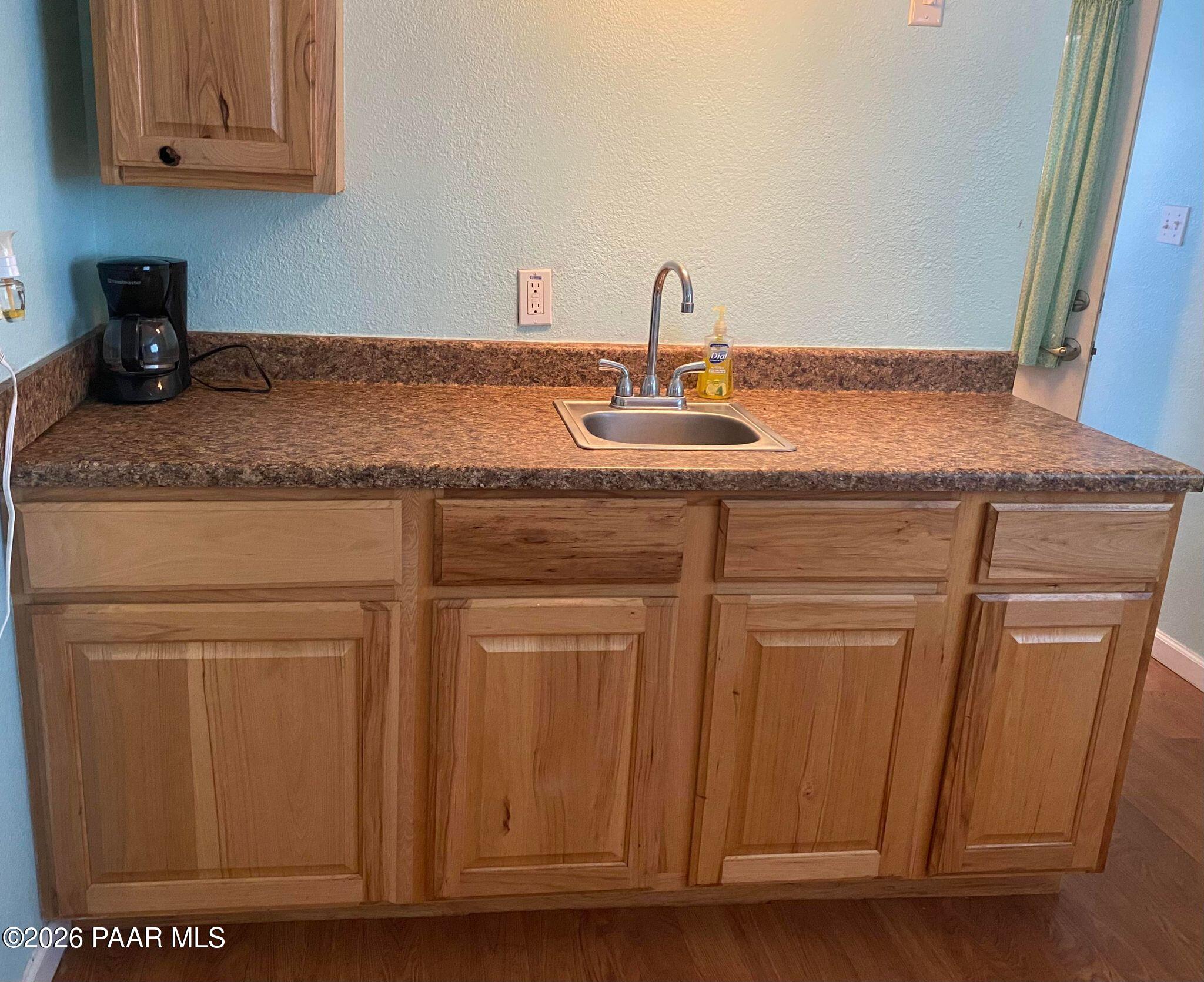 22584 Stone Way Yarnell, AZ 85362 - Photo 27 of 36 a kitchen with a sink and cabinets