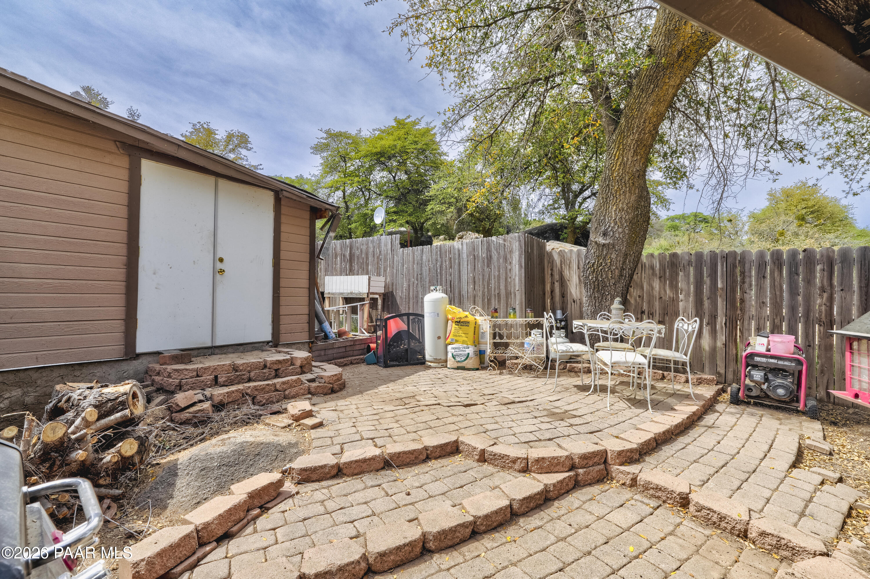 22584 Stone Way Yarnell, AZ 85362 - Photo 31 of 36 a view of a dinning tables and chairs in the patio