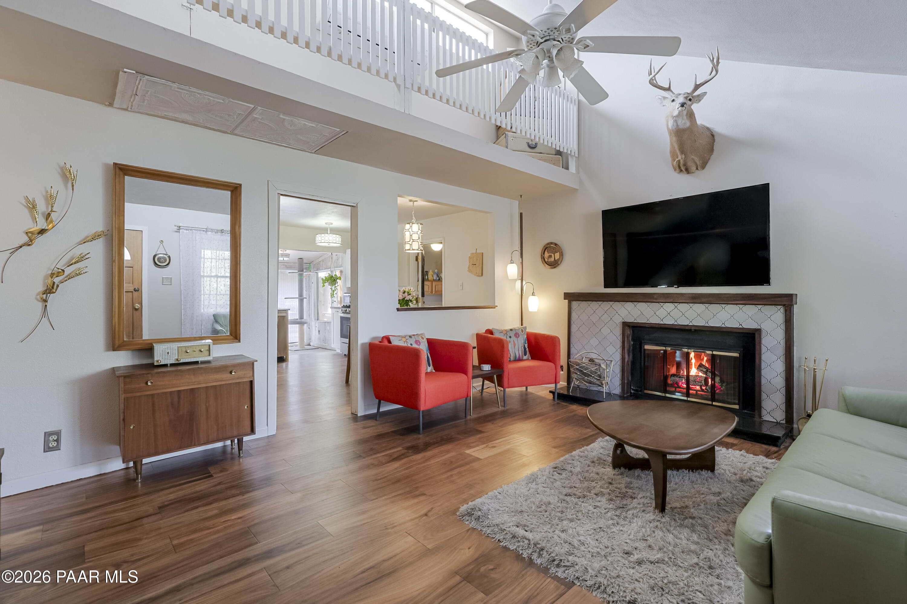 22584 Stone Way Yarnell, AZ 85362 - Photo 8 of 36 a living room with furniture a fireplace and a flat screen tv