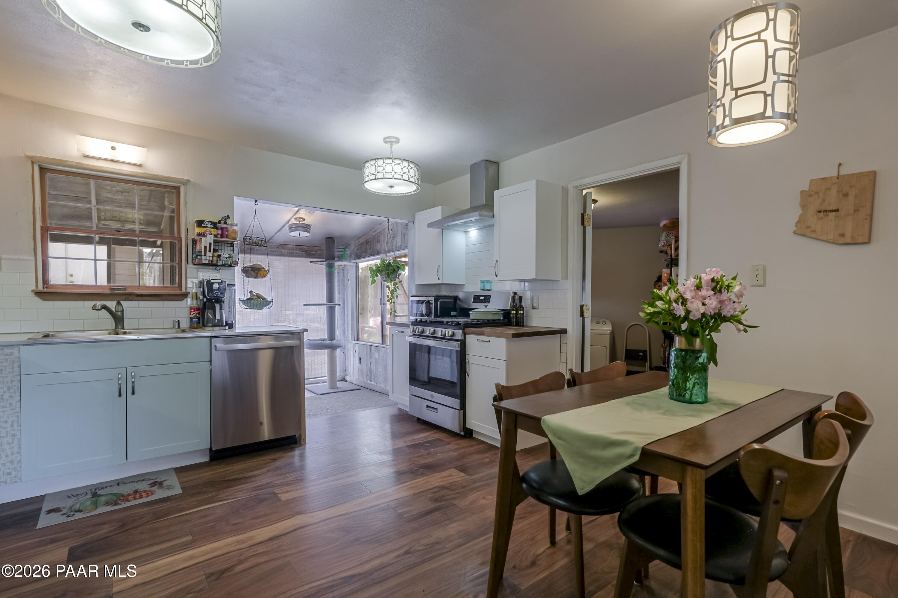 22584 Stone Way Yarnell, AZ 85362 - Photo 9 of 36 a kitchen with a dining table chairs and refrigerator