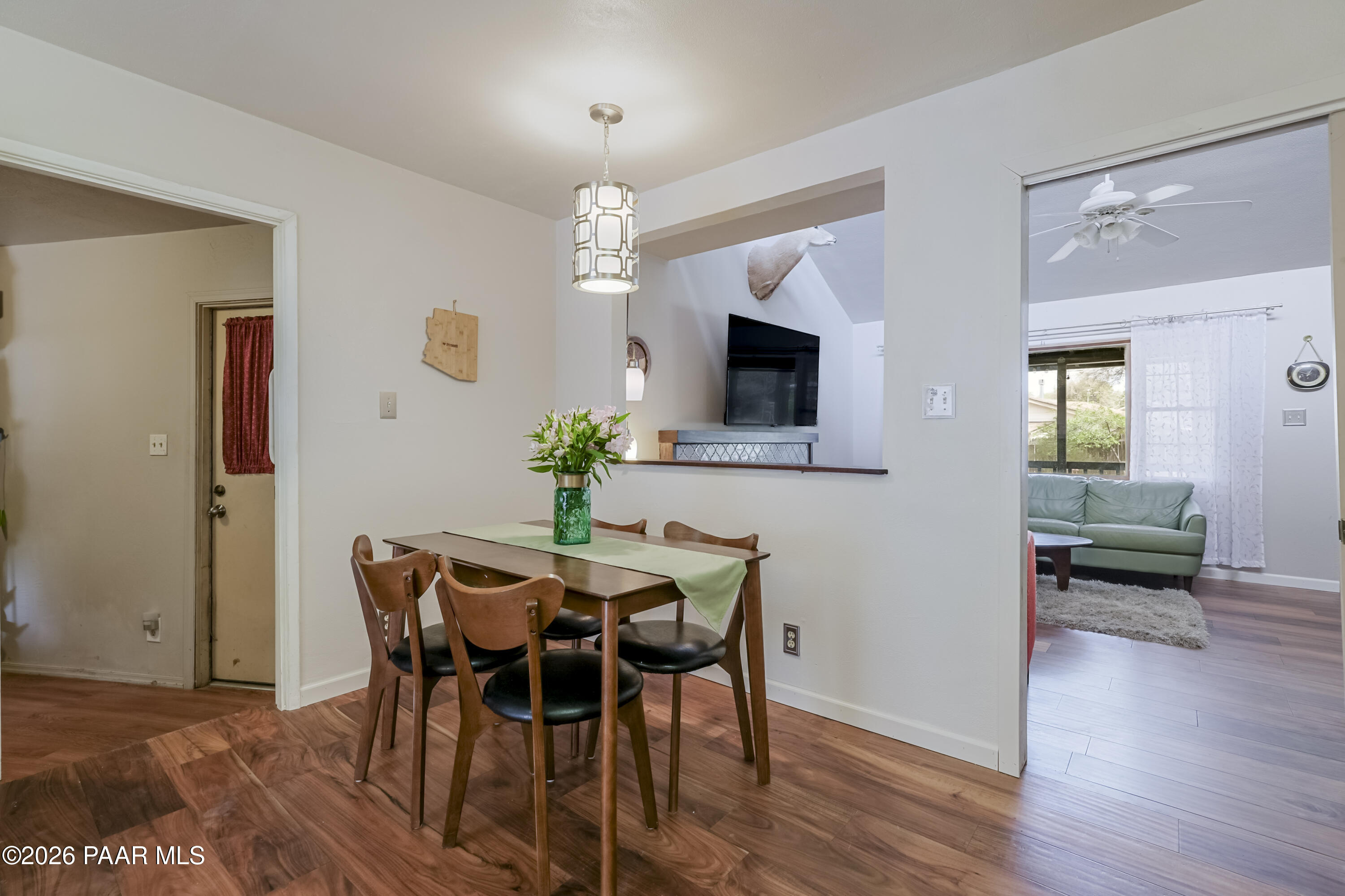 22584 Stone Way Yarnell, AZ 85362 - Photo 10 of 36 a view of a dining room with furniture and wooden floor