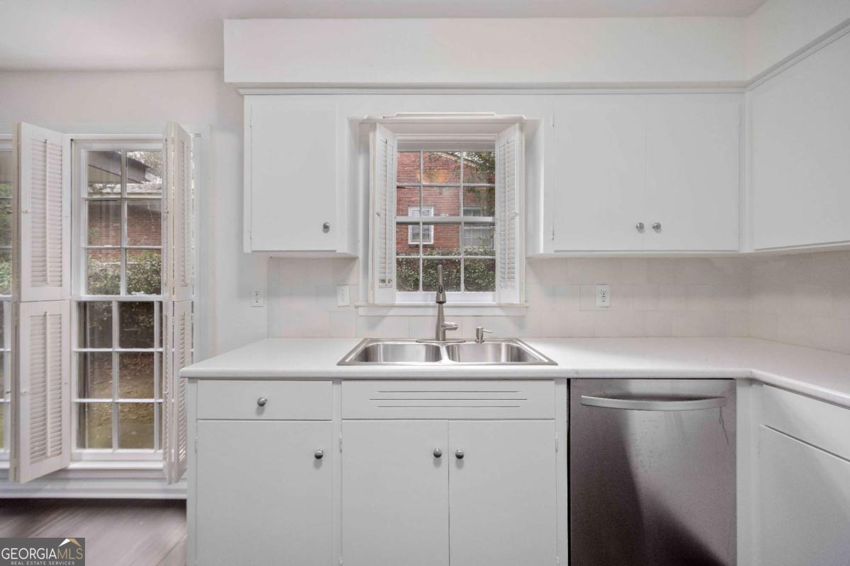 2836 Cromwell Drive Columbus, GA 31906 - Photo 13 of 34 a kitchen with a sink and cabinets