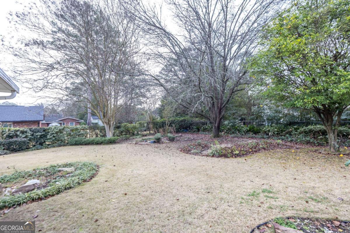 2836 Cromwell Drive Columbus, GA 31906 - Photo 26 of 34 a view of a dirt road with large trees