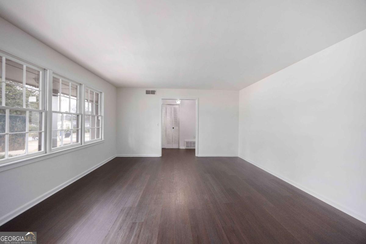 2836 Cromwell Drive Columbus, GA 31906 - Photo 5 of 34 an empty room with wooden floor and windows