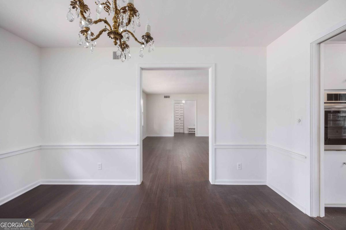 2836 Cromwell Drive Columbus, GA 31906 - Photo 8 of 34 a view of livingroom with hardwood floor and a hallway
