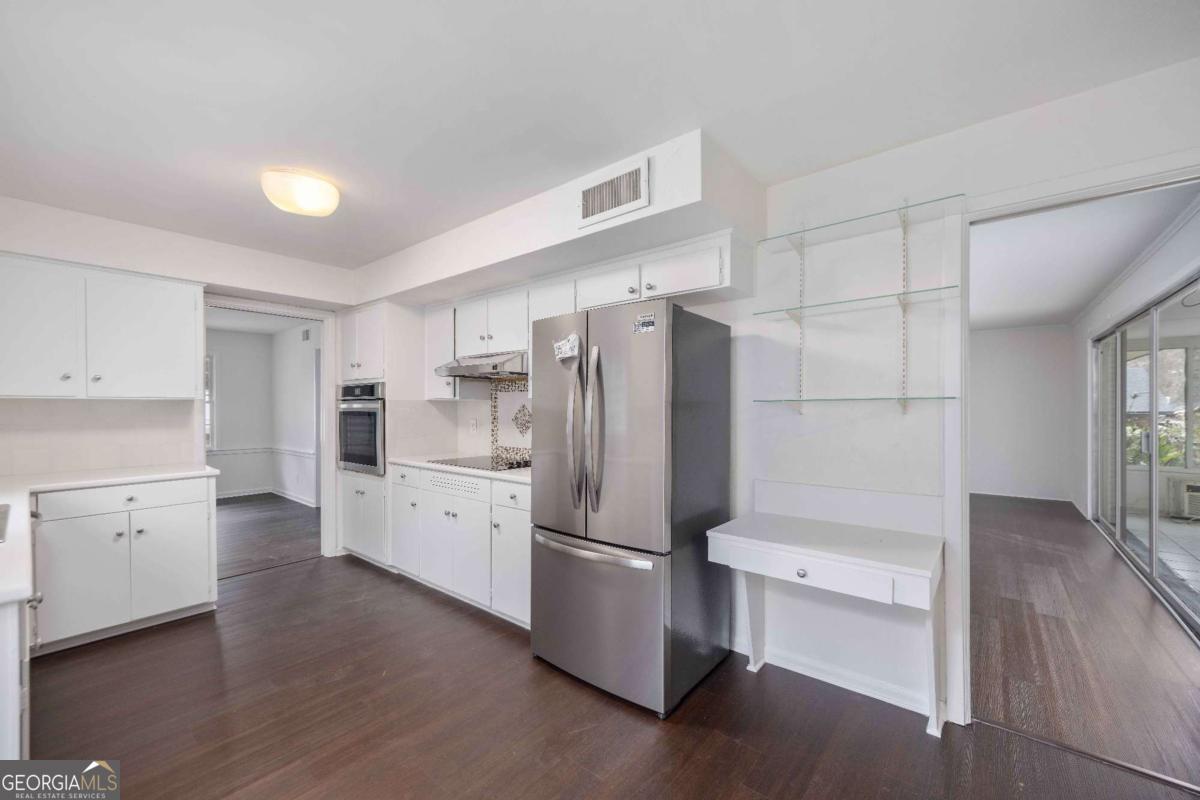 2836 Cromwell Drive Columbus, GA 31906 - Photo 9 of 34 a kitchen with a refrigerator a sink and dishwasher