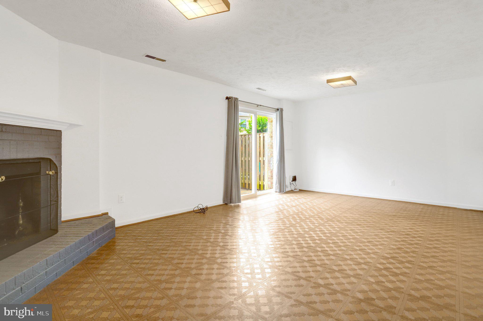 2225 North Tuckahoe Street Arlington, VA 22205 - Photo 23 of 37 a view of an empty room with wooden floor