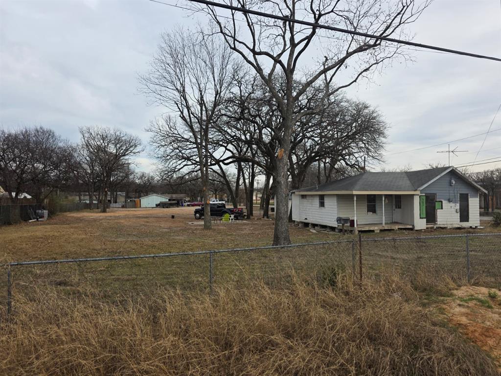 3422 Peachtree Road Balch Springs, TX 75180 - Photo 11 of 17 a view of a yard with a house