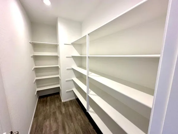 a storage room with wooden floor