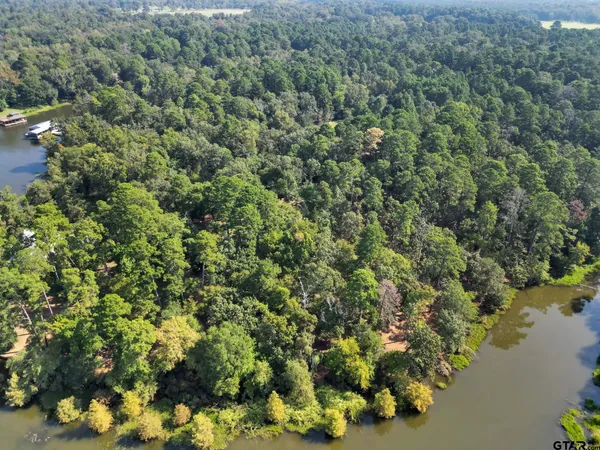 an aerial view of a houses with yard