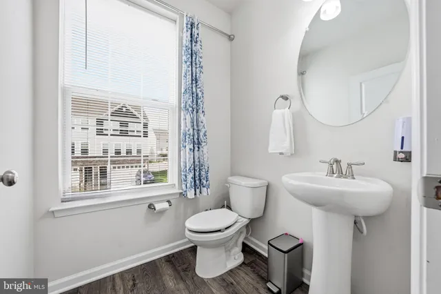 a view of a hallway with wooden shelves