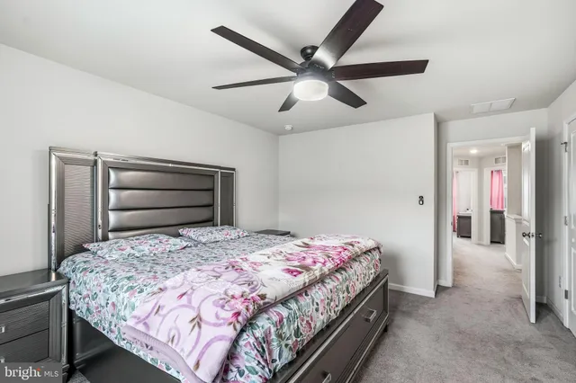a bathroom with a double vanity sink mirror and shower