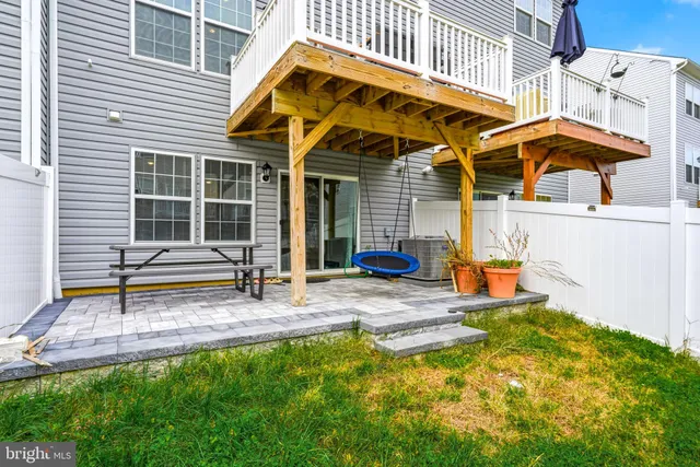a view of house with garden and deck