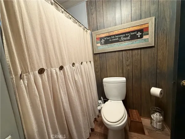a bathroom with a toilet and a sink