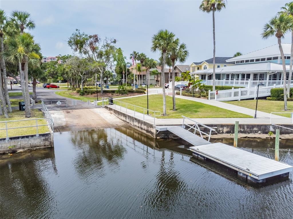 6241 Bayside Drive New Port Richey, FL 34652 - Photo 72 of 78 a view of a swimming pool with a patio and a lake view