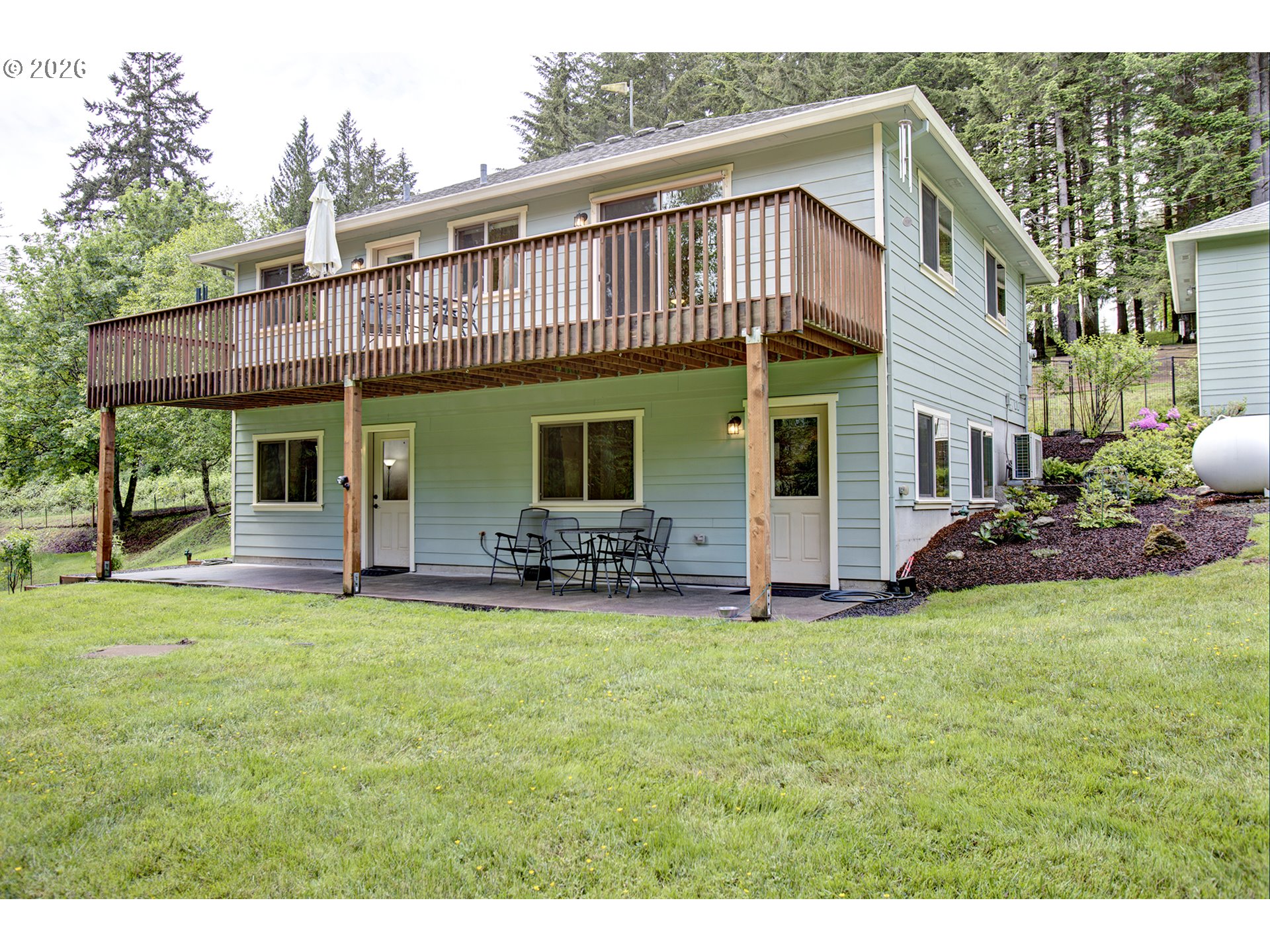 60300 Rays Way St. Helens, OR 97051 - Photo 24 of 41 a view of a house with a yard and sitting area