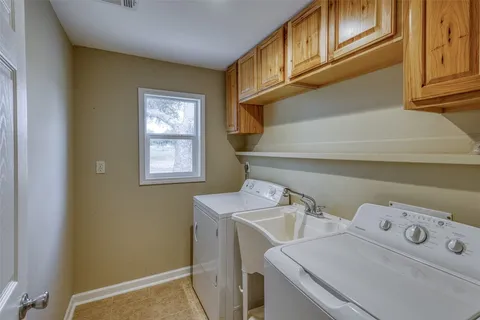 a bathroom with a sink toilet and vanity