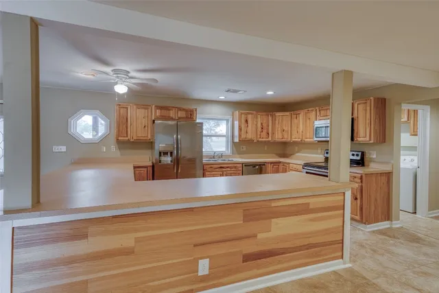 a kitchen with white cabinets