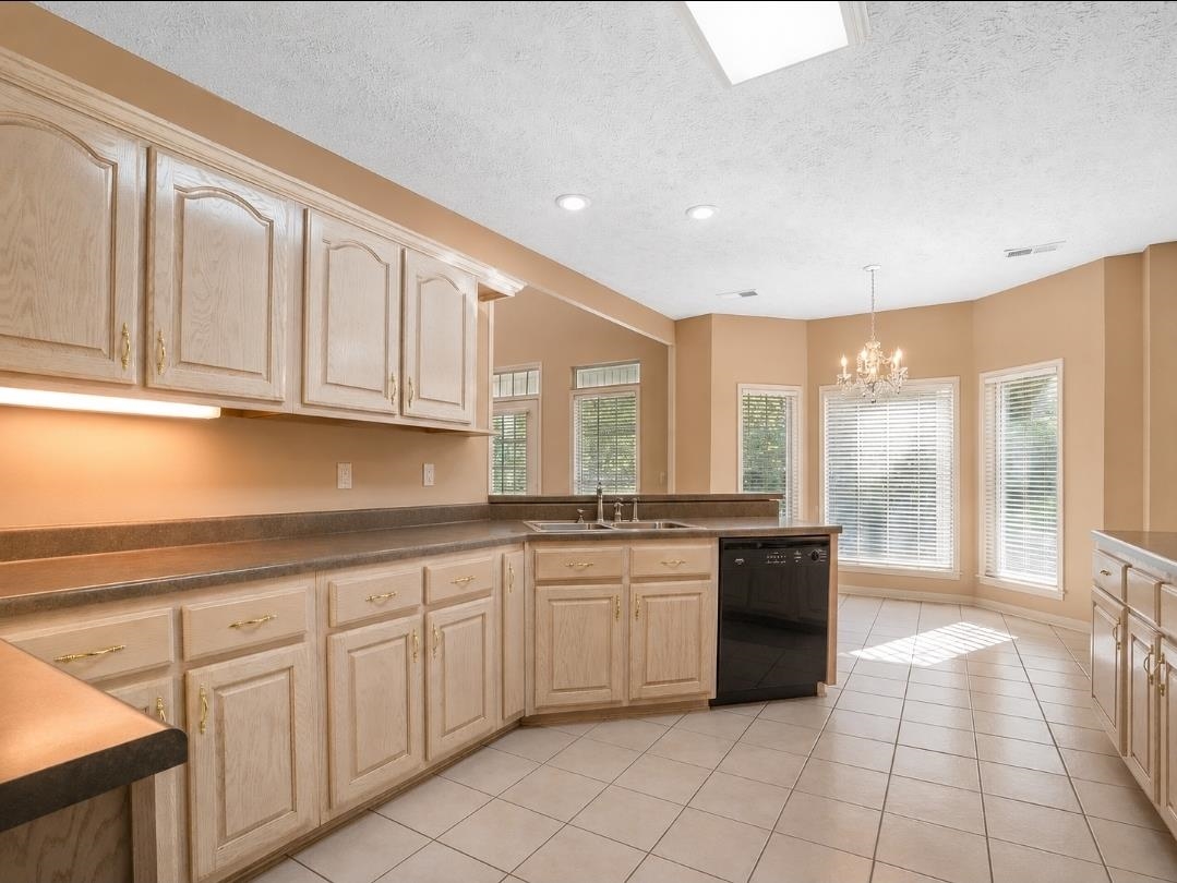 3779 Dancyville Road Stanton, TN 38069 - Photo 3 of 22 Kitchen featuring light wood cabinetry, dark countertops, and a full suite of appliances