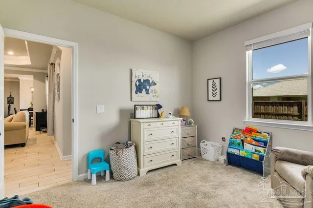 a view of a bedroom with baby toys